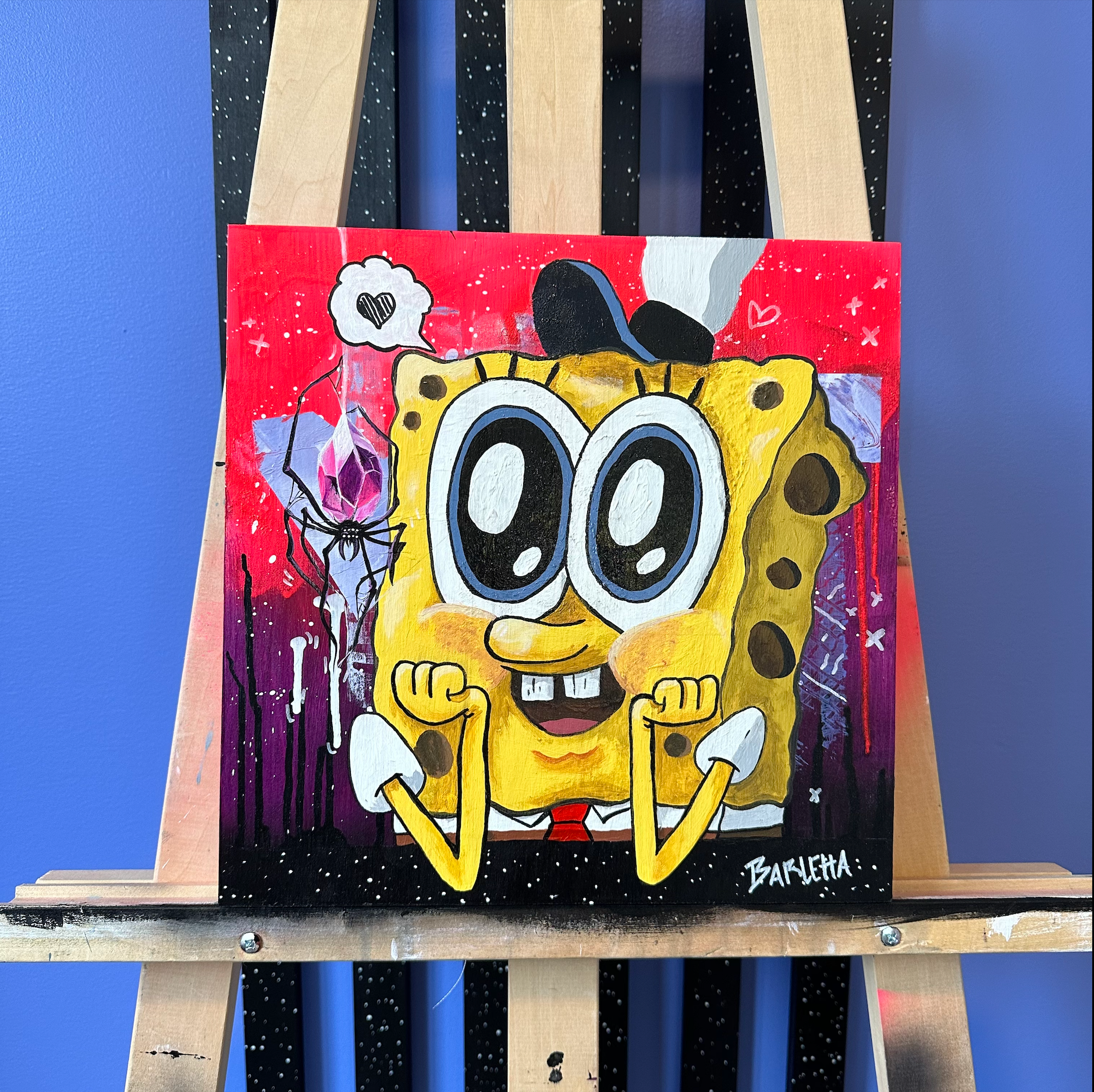 An acrylic painting on wood canvas made by the artist Catherine Barletta. showing a weird love between SpongeBob and a shinny crystal spider